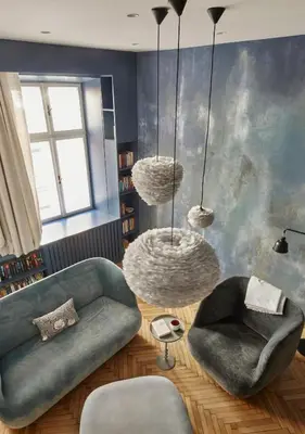 a living room with a couch and two chairs at Luella in Kraków