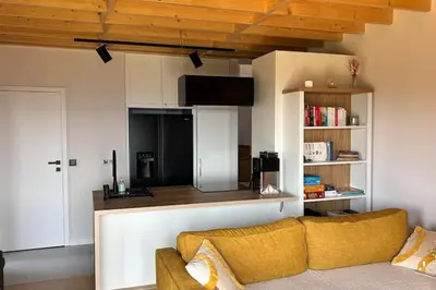 a living room with a couch and a kitchen at Closer to Heaven, 825m above sea, Koskowa Mtn in Bogdanówka