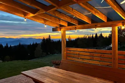 a wooden deck with a view of the mountains at Closer to Heaven, 825m above sea, Koskowa Mtn in Bogdanówka