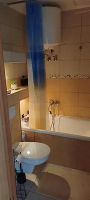 a bathroom with a toilet and a bath tub at Na Podwalu in Jaworzno