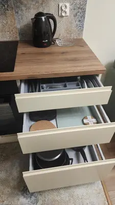 a kitchen drawer with a tea pot on top of it at New 1-Bdrm Apt in Beautiful Kraków in Kraków
