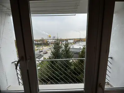 an open window with a view of a parking lot at Mieszkaj u Marty stale na Stałym in Jaworzno