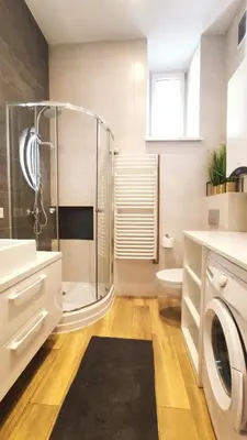a bathroom with a shower and a toilet and a sink at Krowoderska 55 by Homeprime in Kraków