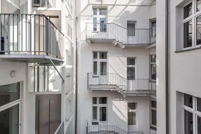 an apartment building with balconies on the side of it at Old Town Apartments - B5 in Kraków