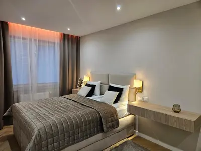 a room with a closet and a door with a microwave at Bagry Luxury Apartment 19 in Kraków