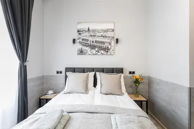a bedroom with a bed and a window at DOLCE VITA Elegant Apartments in Kraków
