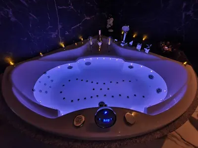 a jacuzzi tub in a room with lights at Apartament z jacuzzi Kraków Rynek in Kraków