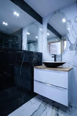 a bathroom with a sink and a mirror at Apartament Mikołaja w Rabce in Rabka