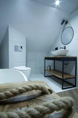 a bathroom with a sink and a tub and a toilet at Apartament Mikołaja w Rabce in Rabka