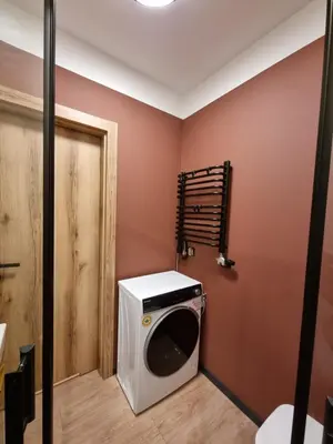 a laundry room with a washer and dryer at Apartment in the heart of Old Podgórze in Kraków