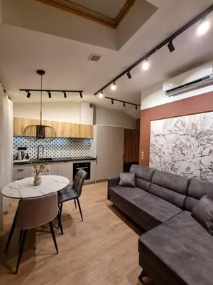 a living room with a couch and a table at Apartment in the heart of Old Podgórze in Kraków