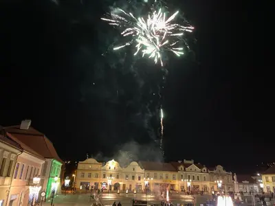 a fireworks display in the sky over a town at Apartament studio z widokiem na Rynek in Bochnia