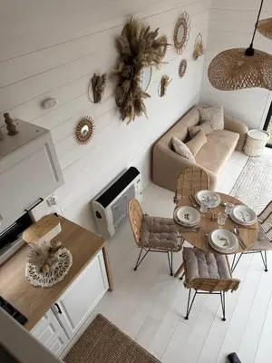 a living room with a couch and a table at Domek na Odludziu - Tiny House in Spytkowice