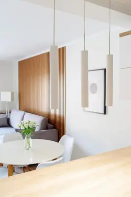 a living room with a table and a couch at Native Apartments Barska 13 in Kraków
