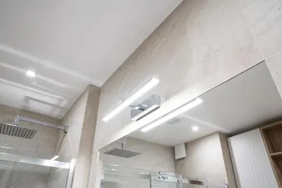 a bathroom with a shower and a ceiling at Luxury Apartments in Kraków