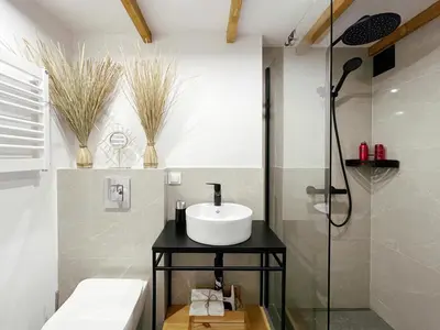 a bathroom with a sink and a shower at Nad Szklarnią in Kraków