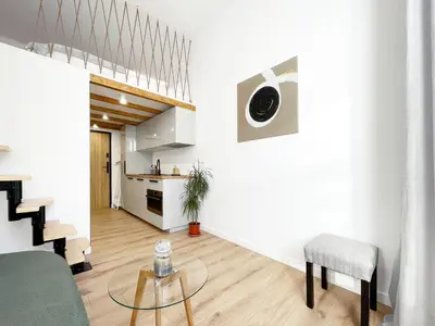 a living room with a couch and a table at Nad Szklarnią in Kraków