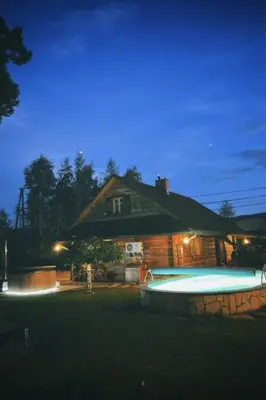 a house with a trash can in front of it at Zacisze Pod Lipą in Andrychów