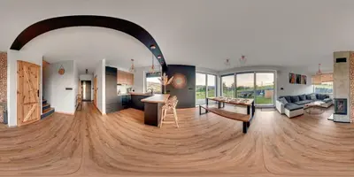 a kitchen and living room with a wooden floor at Stodołówka in Budzów