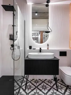 a bathroom with a sink and a mirror at Luxury two-bedroom apartment with terrace by Tyzenhauz in Kraków