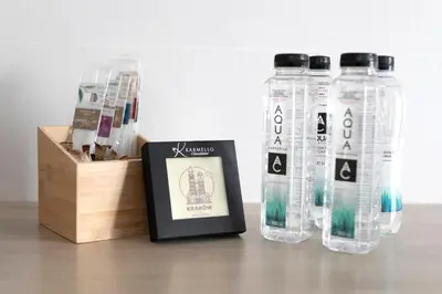 a group of bottles sitting next to a wooden box at Apartament Szary in Kraków
