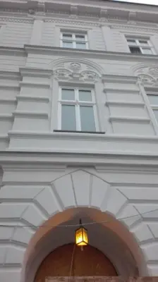 a building with a light over an archway at Modern apartament in the Old Town in Kraków