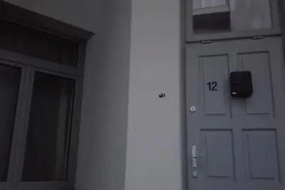 a door with the number on the side of a building at Modern apartament in the Old Town in Kraków