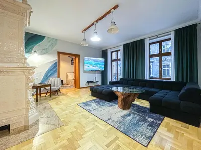 a living room with a couch and a fireplace at Old Town Kraków - Unique Apartment Euphorie in Kraków