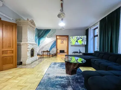 a living room with a couch and a table at Old Town Kraków - Unique Apartment Euphorie in Kraków