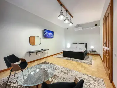 a bedroom with a bed and a glass table at Old Town Kraków - Unique Apartment Euphorie in Kraków