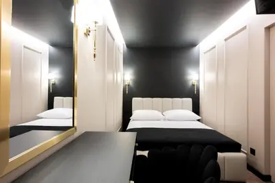 a hallway with wooden doors and a hallway with a tile floor at Native Apartments Kościuszki 39I24 in Kraków