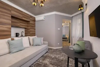 a living room with a couch and a table at One bedroom apartment- Rakowicka 6 in Kraków
