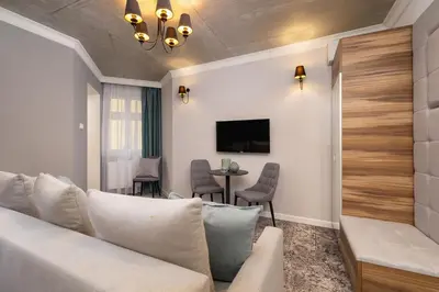 a living room with a couch and a table at One bedroom apartment- Rakowicka 6 in Kraków