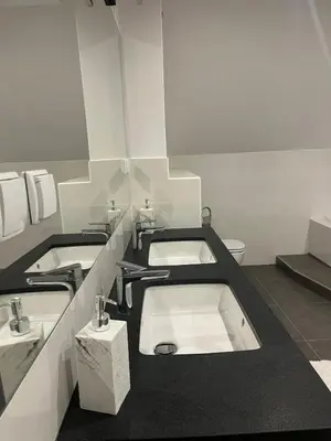 a bathroom with three sinks and a toilet at B-Willa Słopnice basen & jacuzzi, sauna in Słopnice
