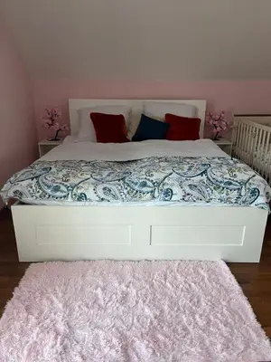 a large bed with a blue and white comforter at B-Willa Słopnice basen & jacuzzi, sauna in Słopnice