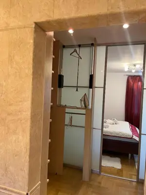a room with a mirror and a bed in it at B-Willa Słopnice basen & jacuzzi, sauna in Słopnice