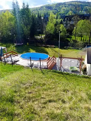 a yard with two trampolines and a playground at Zawojskie Spanie in Zawoja