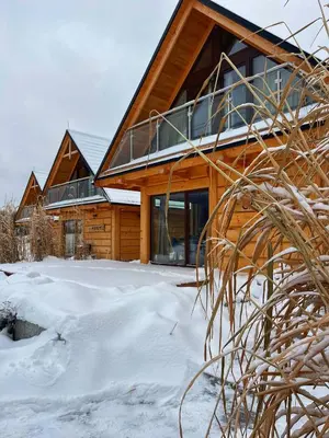 a log cabin in the winter with snow at Beskidzkie Wyspy in Tenczyn