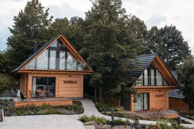 a house with a large window on the side of it at Beskidzkie Wyspy in Tenczyn