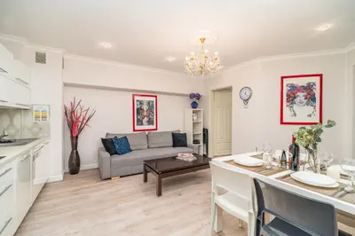 a living room with a couch and a table at Piasek Apt - Top Location, Patio, Tram&Bus nearby - by Rentujemy in Kraków