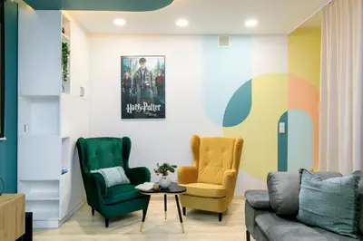 a living room with two chairs and a couch at Premium City Center Apartment Ariańska in Kraków