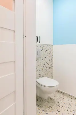a bathroom with a toilet in the corner at Premium City Center Apartment Ariańska in Kraków