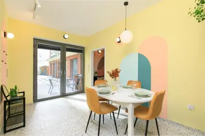 a dining room with a white table and chairs at Premium City Center Apartment Ariańska in Kraków