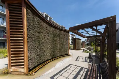 a fence in front of some apartment buildings at Dębniki Pleasant Studio by BookingHost in Kraków