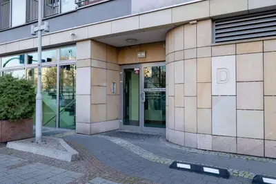 a building with a glass door in front of it at Exceptional Apartment with Balcony by Noclegi Renters in Kraków