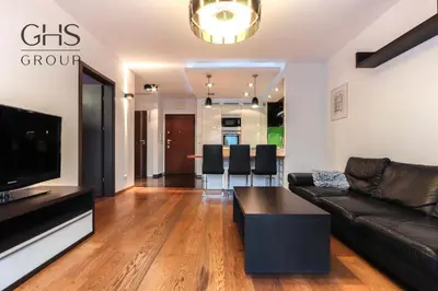 a living room with a couch and a table at Beautiful apartment in the city center, Angel City in Kraków