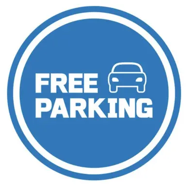 a free parking sign with a car in a circle at Beautiful apartment in the city center, Angel City in Kraków