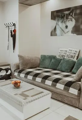 a small room with a bed and a table with a flower on it at GRAND COMFORT 3 Bedroom, 3 Bathroom, Ground Floor&Fresh Air in Kraków