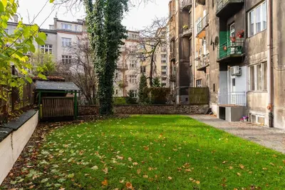 a yard in the middle of a city with buildings at Słowackiego 43 Apartament in Kraków