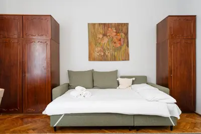 an empty hallway with a door and a window at Mogilska Standard Apartment by BookingHost in Kraków